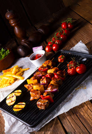 Rustic shish kebab skewers with marinated ham meat paprika and red onionの写真素材