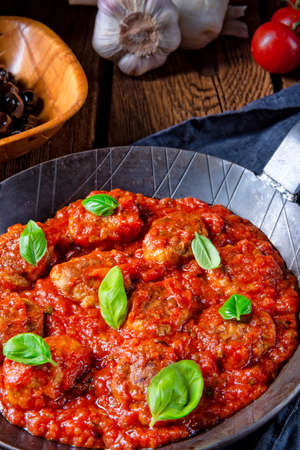 Rustic mini meatballs Baked in tomato sauce with basilの写真素材