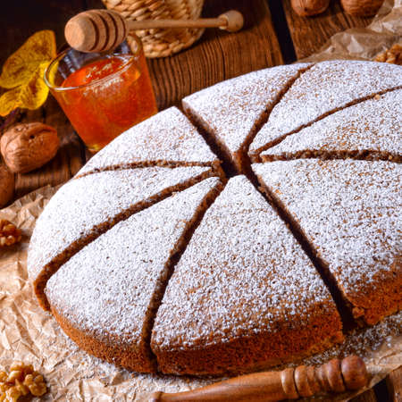 Fresh and tasty autumnal walnut cake with honey