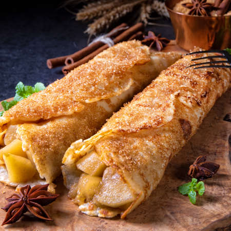 Tasty autumnal omas pancakes with apple and cinnamonの写真素材