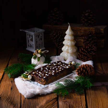 Christmas poppy seed cake with chocolate  nuts and raisinsの写真素材