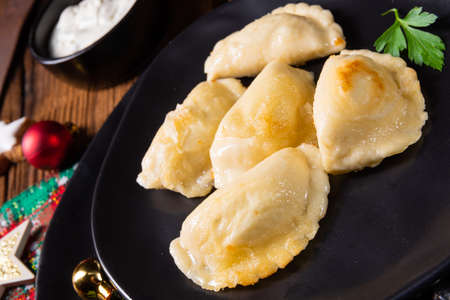 Polish Christmas pierogi with sauerkraut and mushroomsの写真素材