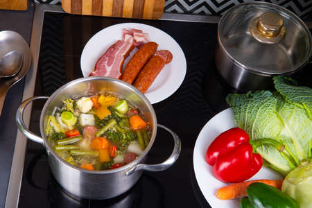 delicious autumnal vegetable soup with sausage and bacon