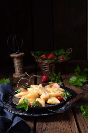 Kopytka - polish potato dumpling with strawberriesの写真素材