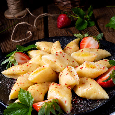 Kopytka - polish potato dumpling with strawberriesの写真素材
