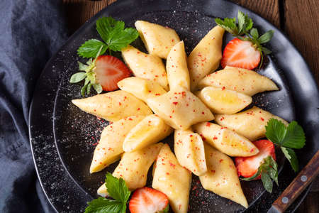 Kopytka - polish potato dumpling with strawberriesの写真素材