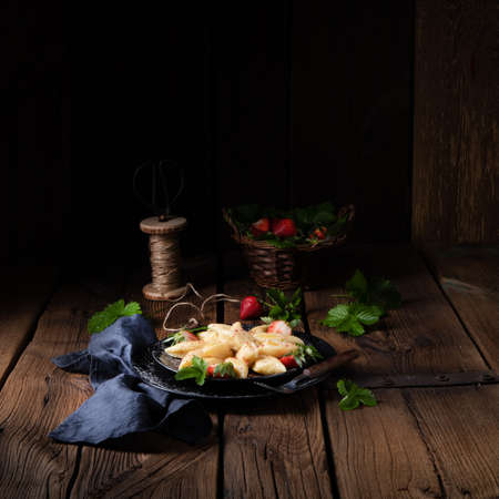 Kopytka - polish potato dumpling with strawberriesの写真素材