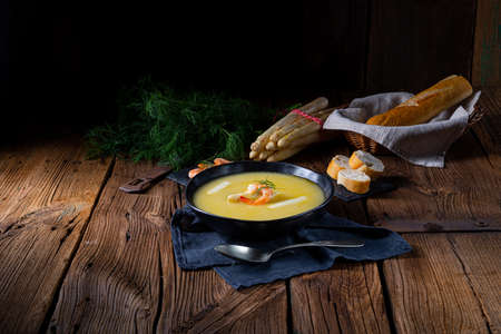 Super delicious asparagus soup with crab and capers .の写真素材