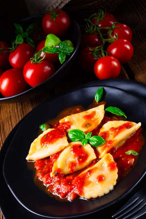 ravioli alla genovese with basil tomato sauceの写真素材
