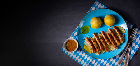 thuringian bratwurst with sauerkraut and dumplingsの写真素材