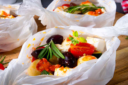 baked small dumplings with zucchini tomatoes and diced sheep's cheese