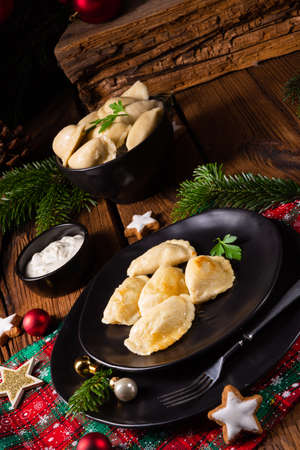 Polish Christmas pierogi with sauerkraut and mushroomsの写真素材