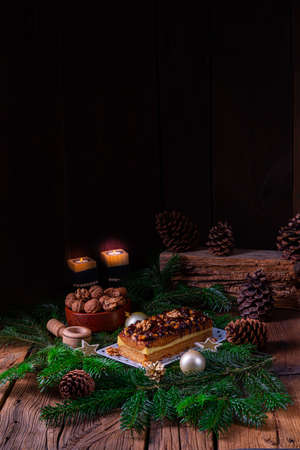 Chocolate gingerbread with filling, jam and nutsの写真素材