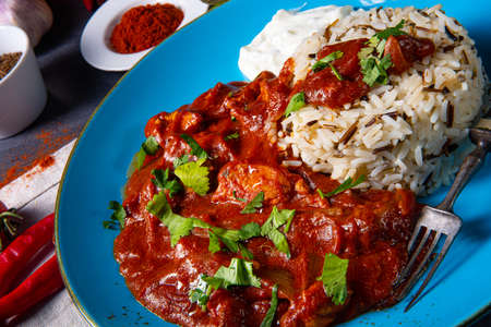 Indian Chicken Tikka Masala with wild riceの写真素材