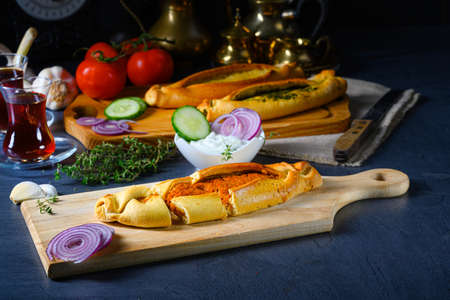 Pide with minced meat, spinach feta and sheep's cheeseの写真素材