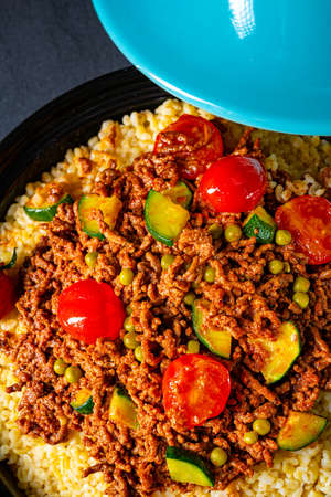 Tomato bulgur with vegetables and minced meatの写真素材