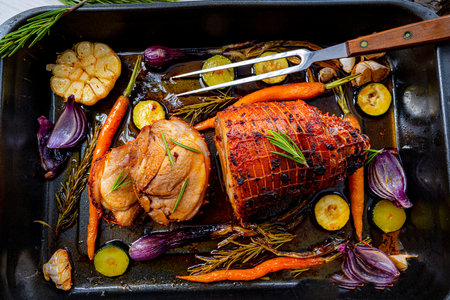 Lecere roll roast with vegetables and herbs.の写真素材