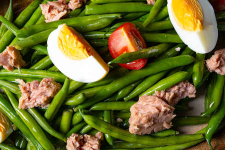 Rustic green bean salad with egg and tunaの写真素材