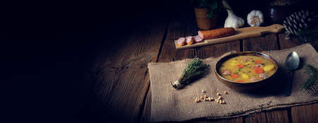 Classic pea soup with sausage and meatの写真素材