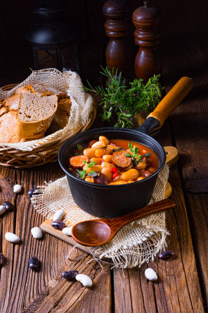 Delicious bean stew with sausage and potatoの写真素材