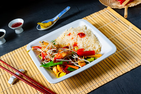 fried sweet and sour chicken with vegetablesの写真素材