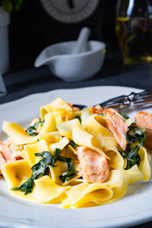Tagliatelle with salmon and spinach in a cream sauceの写真素材