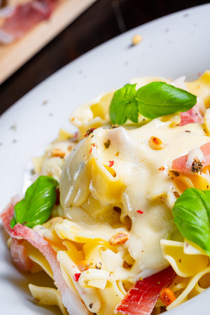 Tagliatelle with gorgonzola, masarpone sauce and ham.の写真素材