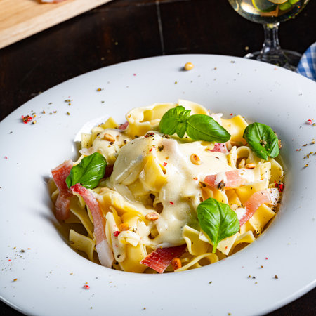 Tagliatelle with gorgonzola, masarpone sauce and ham.の写真素材