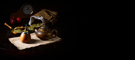 Green tea in a teapot on a dark background. Copy space.の写真素材