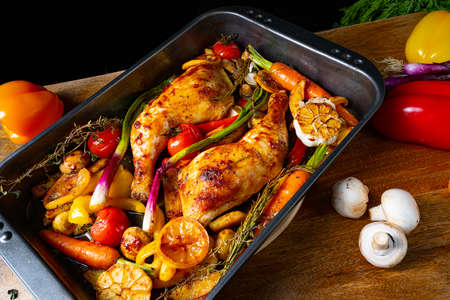 fried chicken legs with various vegetablesの写真素材