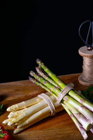 Green and white asparagus on the tableの写真素材