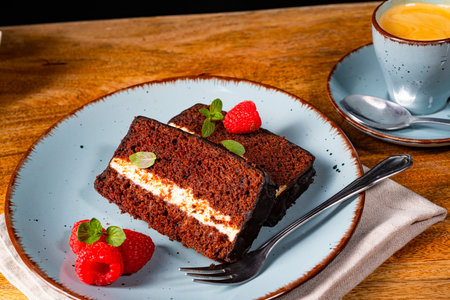 Rustic chocolate cake with raspberries and coffeeの写真素材