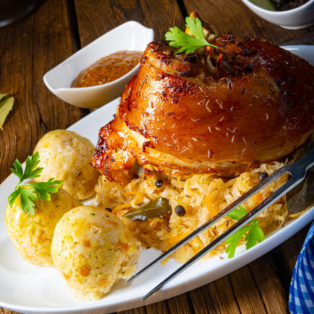 pork knuckle with sauerkraut and sweet mustardの写真素材