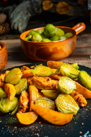 Brussels sprouts, fried chicken breast and potatoesの写真素材