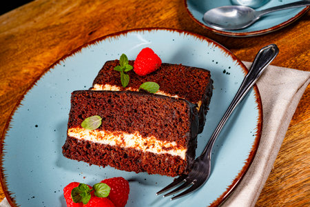 Rustic chocolate cake with raspberries and coffeeの写真素材