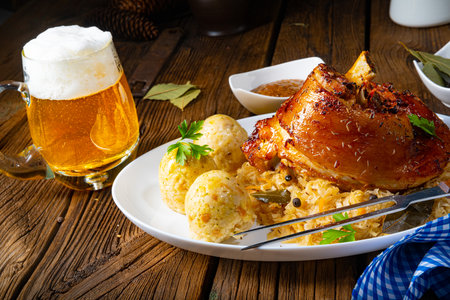 pork knuckle with sauerkraut and sweet mustardの写真素材