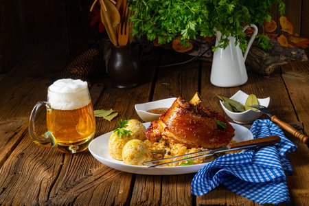 pork knuckle with sauerkraut and sweet mustardの写真素材