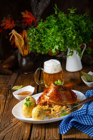 pork knuckle with sauerkraut and sweet mustardの写真素材