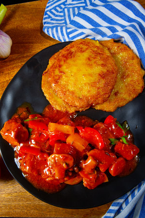 Original Hungarian goulash with potato pancakesの写真素材