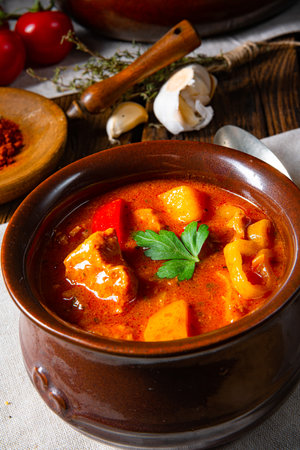 Hungarian goulash soup in a cauldron or potの写真素材