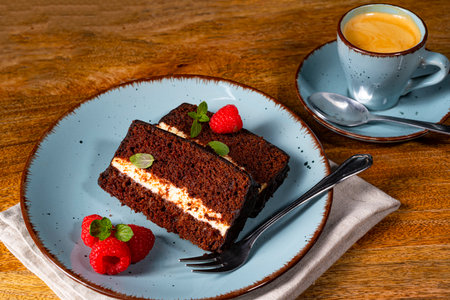 Rustic chocolate cake with raspberries and coffeeの写真素材