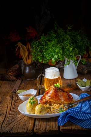 pork knuckle with sauerkraut and sweet mustardの写真素材