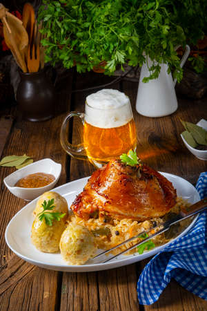 pork knuckle with sauerkraut and sweet mustardの写真素材