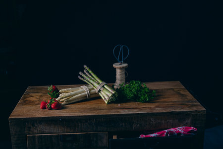 Green and white asparagus on the tableの写真素材