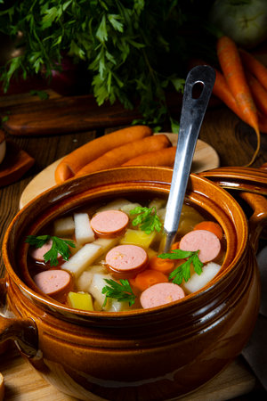 Potato kohlrabi soup with bockwurstの写真素材