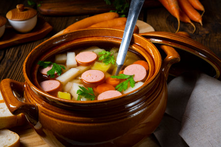 Potato kohlrabi soup with bockwurstの写真素材