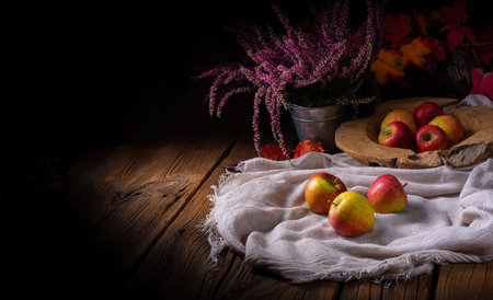 Freshly picked ripe apples on a tableの写真素材