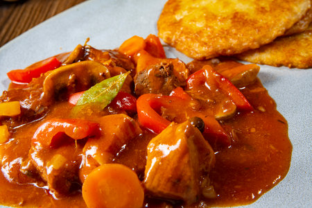 Hungarian goulash with potato pancakesの写真素材