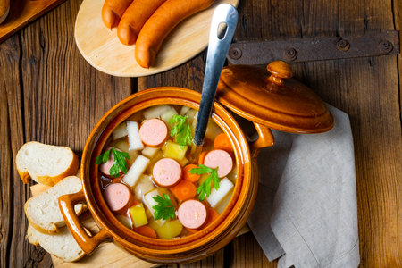 Potato kohlrabi soup with bockwurstの写真素材