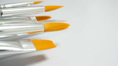 Brushes for painting with orange tips.の写真素材